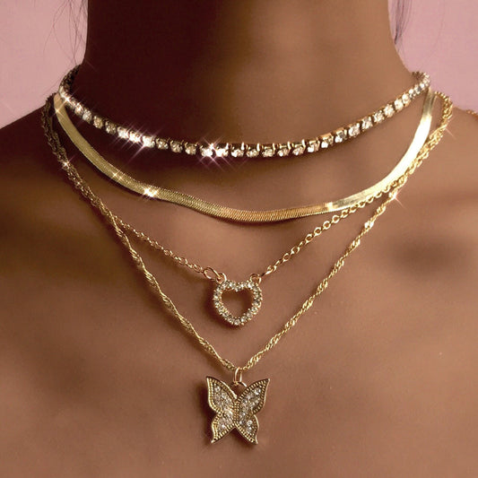 Collana farfalla e cuore traforata con diamanti