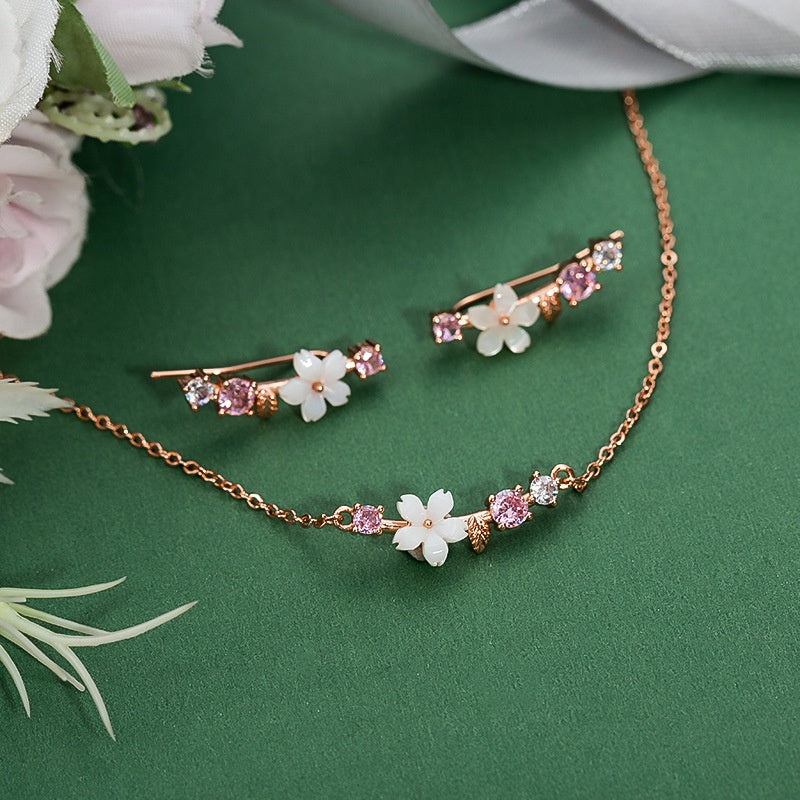 Orecchini farfalla e fiore con perla