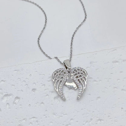 Collana acciaio titanio cuore farfalla girasole