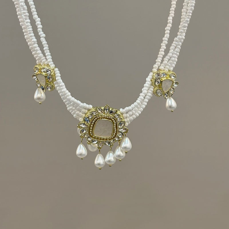 Set collana orecchini fiore con nappa