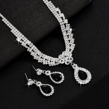 Set collana e orecchini goccia e fiore con cristalli
