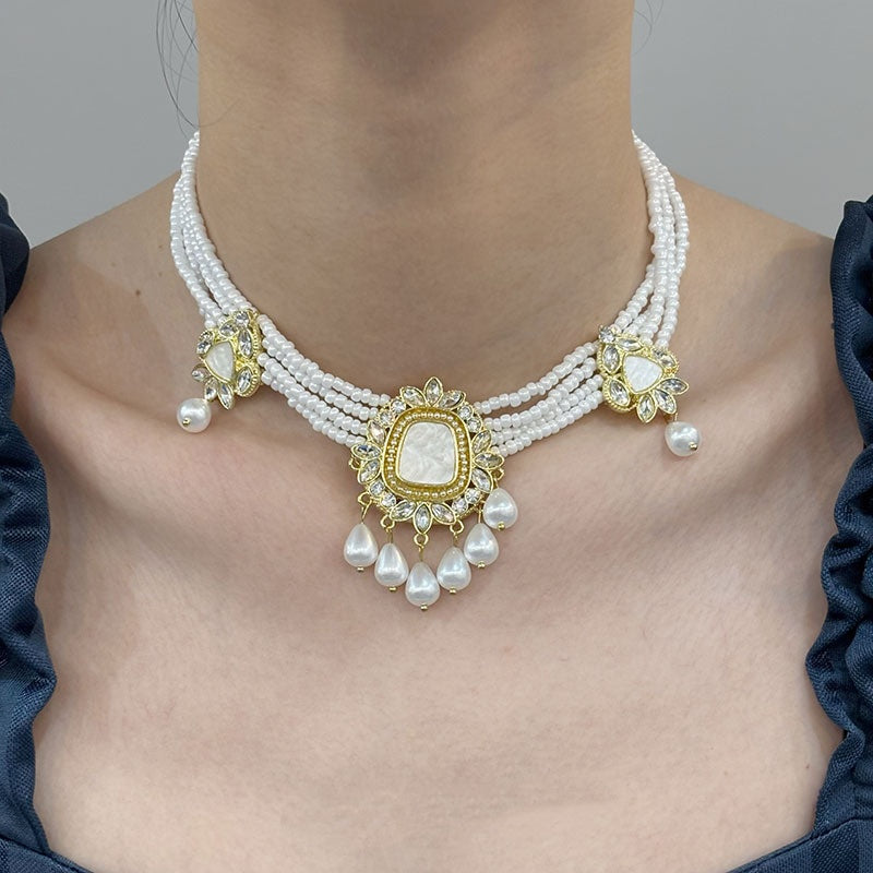 Set collana orecchini fiore con nappa