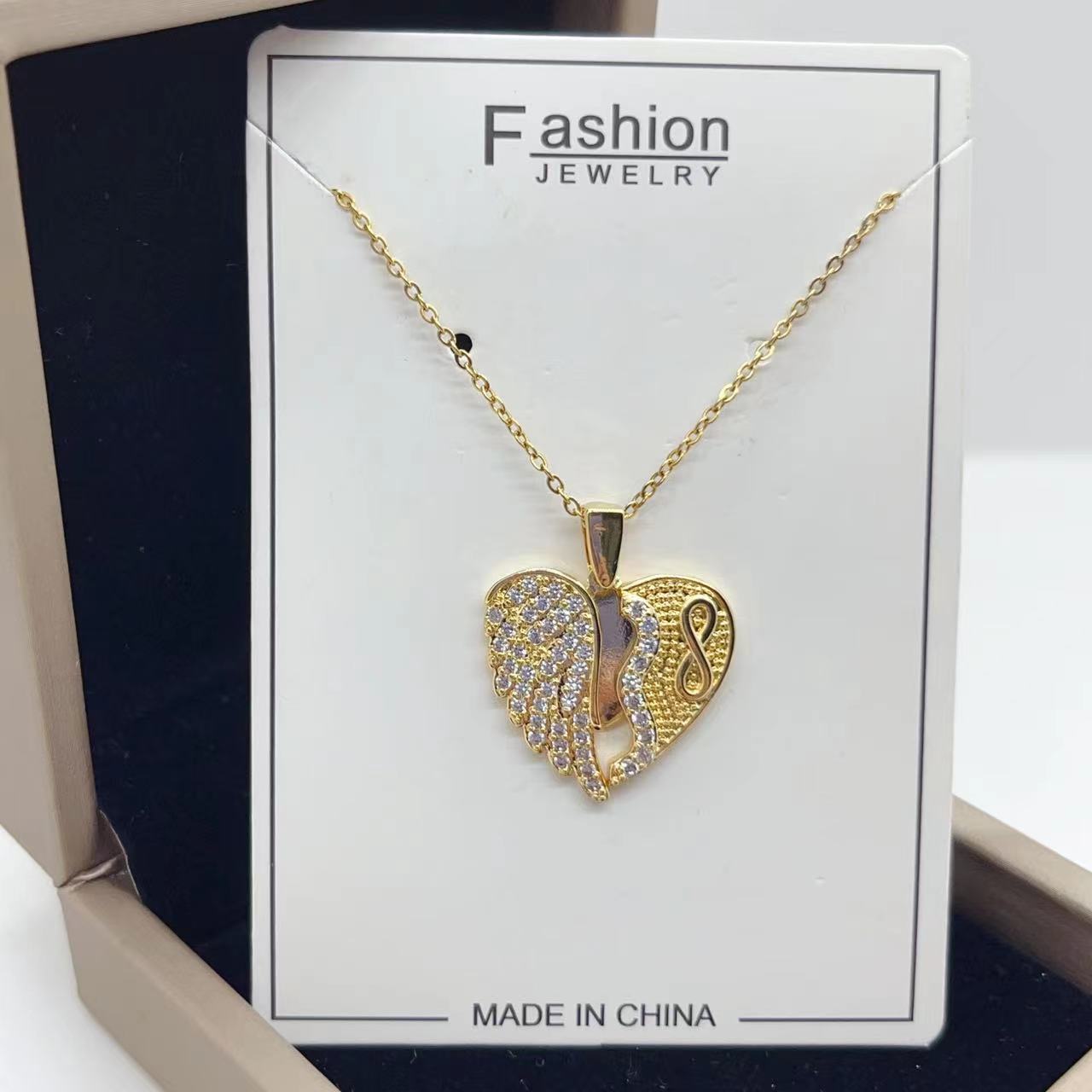 Collana acciaio titanio cuore farfalla girasole