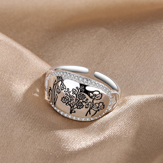 Anello geometrico fiore e erba