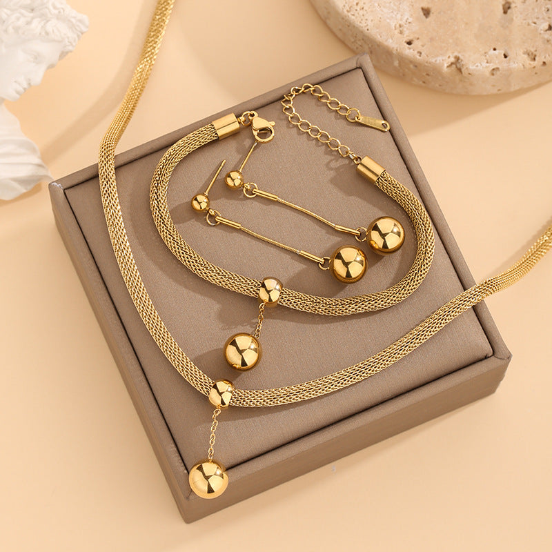 Collana sfere dorate con nappa