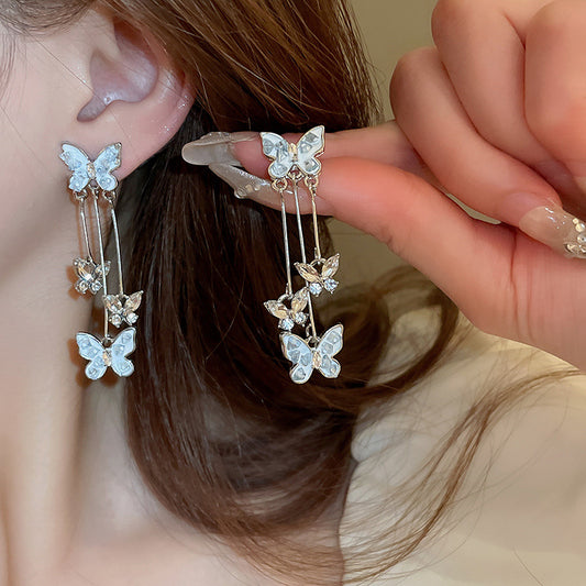 Orecchini farfalla strass frangia