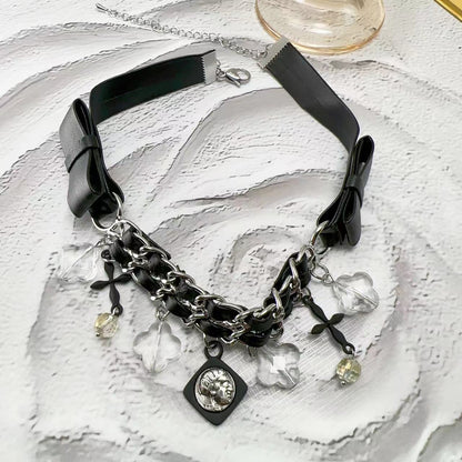 Collana croce pelle intrecciata