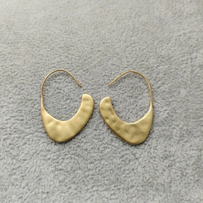 Orecchini geometrici dorati in ottone