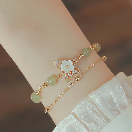 Bracciale conchiglia farfalla con fiore