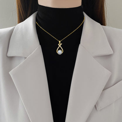 Collana croce con perla e strass