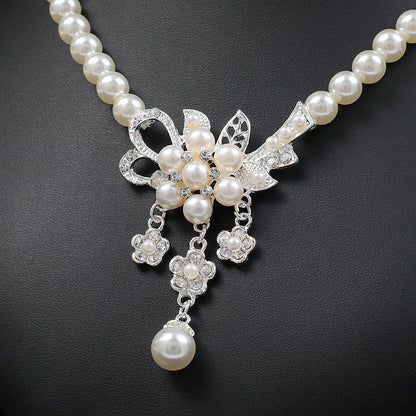 Collana e orecchini perle floreali