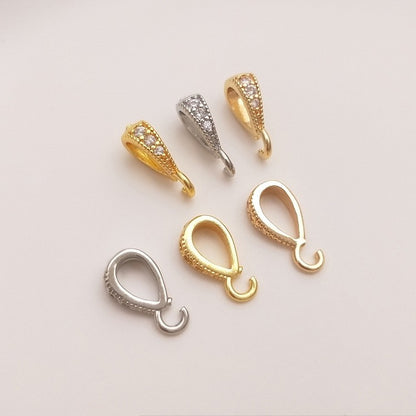 Fibbia ovale dorata con zircone