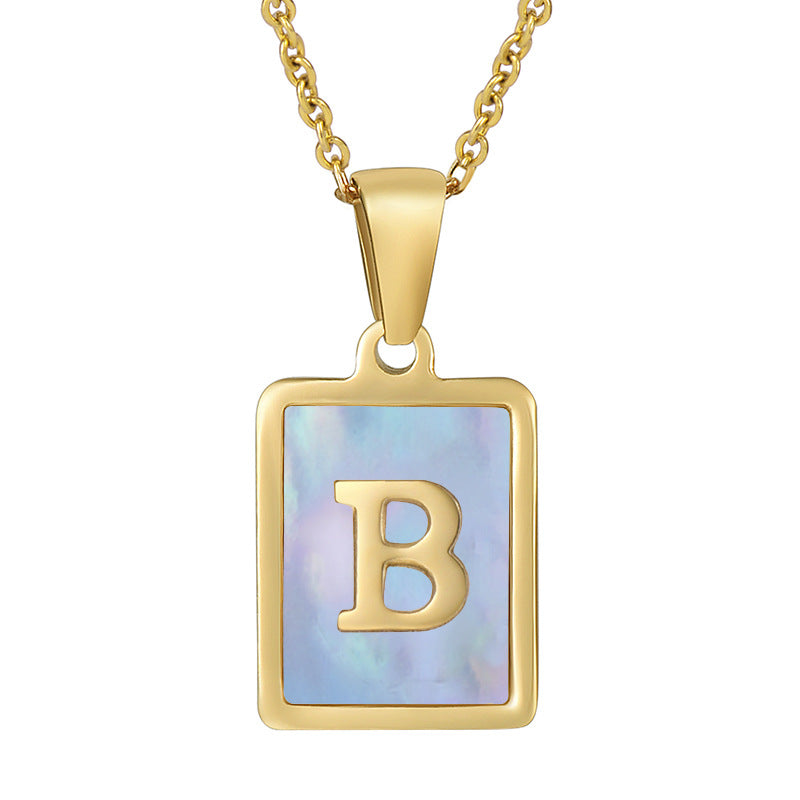 Collana titanio con lettera e conchiglia