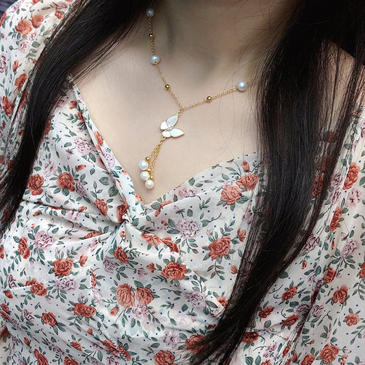 Collana perle farfalla nappa