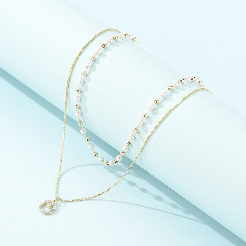 Collana anello doppia perla