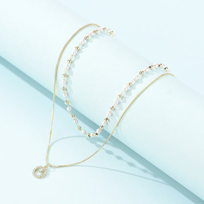 Collana anello doppia perla