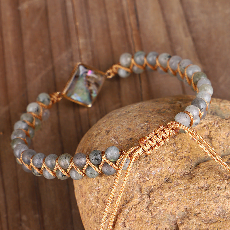 Bracciale intrecciato conchiglia e pietre