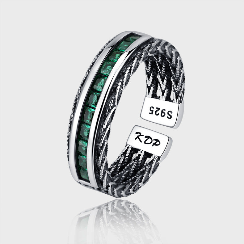 Anello smeraldo e zircone intrecciato